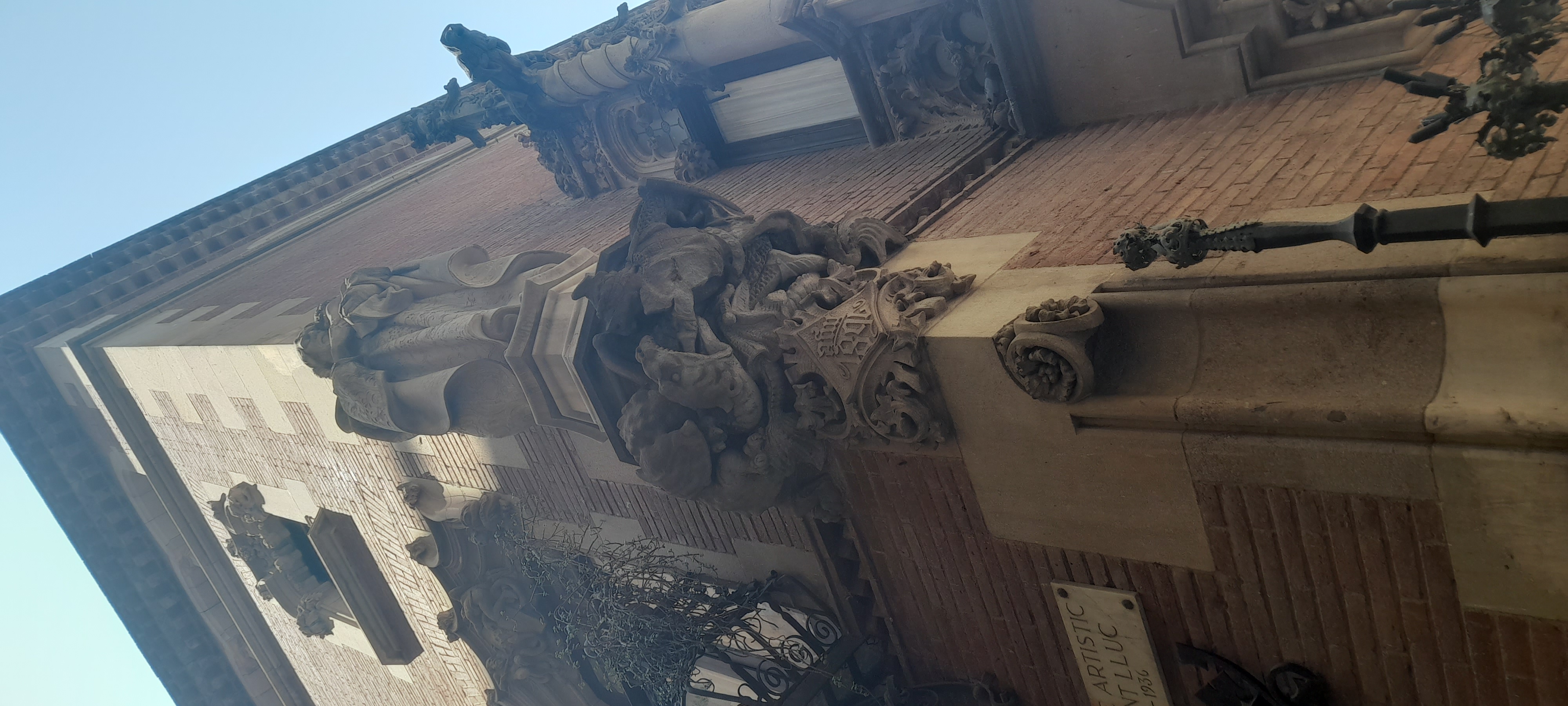 Wow look at all the completely necessary details, of dragons and spirals and wrought iron balcony railing and brickwork and corbels innumerable